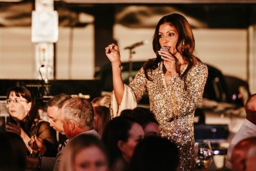 Charity gala attendees supporting a nonprofit fundraising auction.
